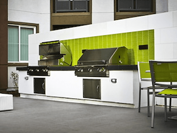 pgs built in grills in an outdoor patio with green accents